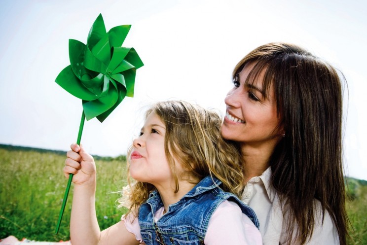 Woman and girl with toy windmill